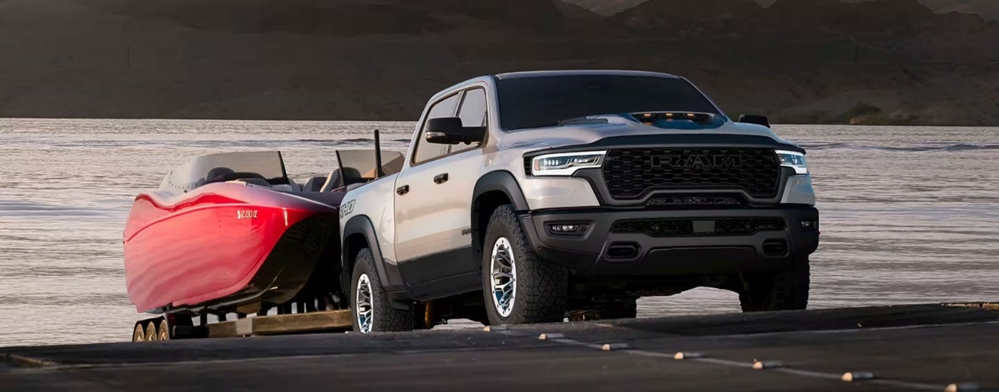 A silver 2025 Ram 1500 from the front.