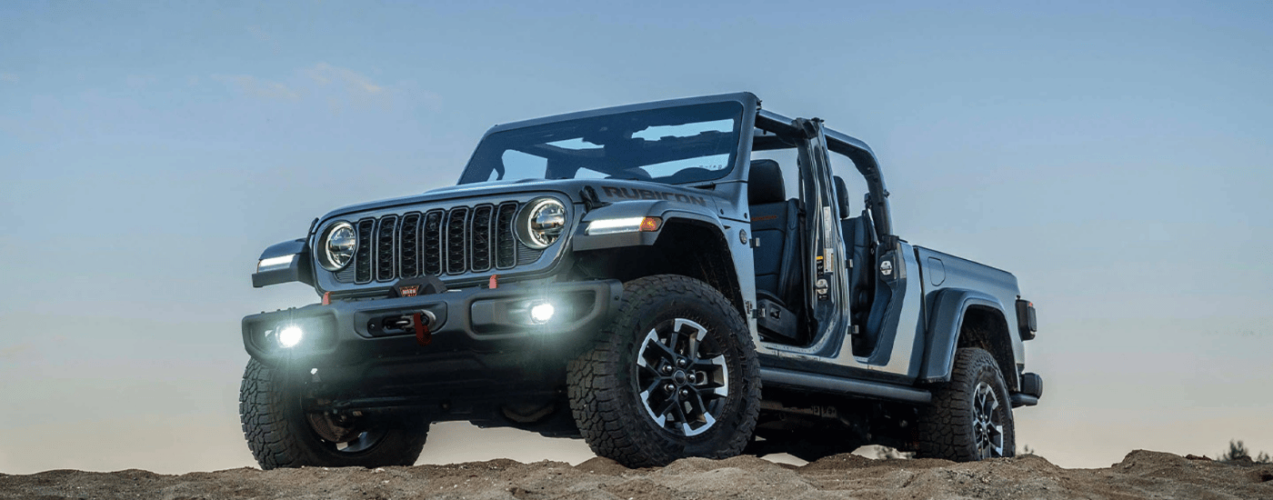 Grey 2026 Jeep Gladiator parked high up on sand