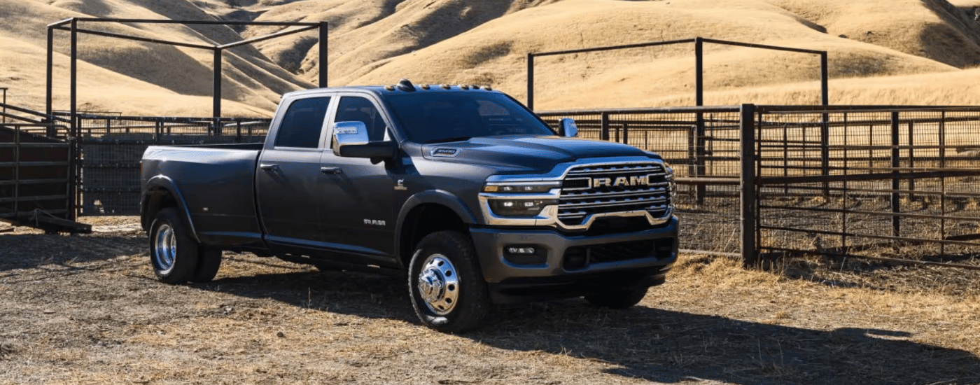 Grey 2026 Ram 3500 DRW parked on a ranch