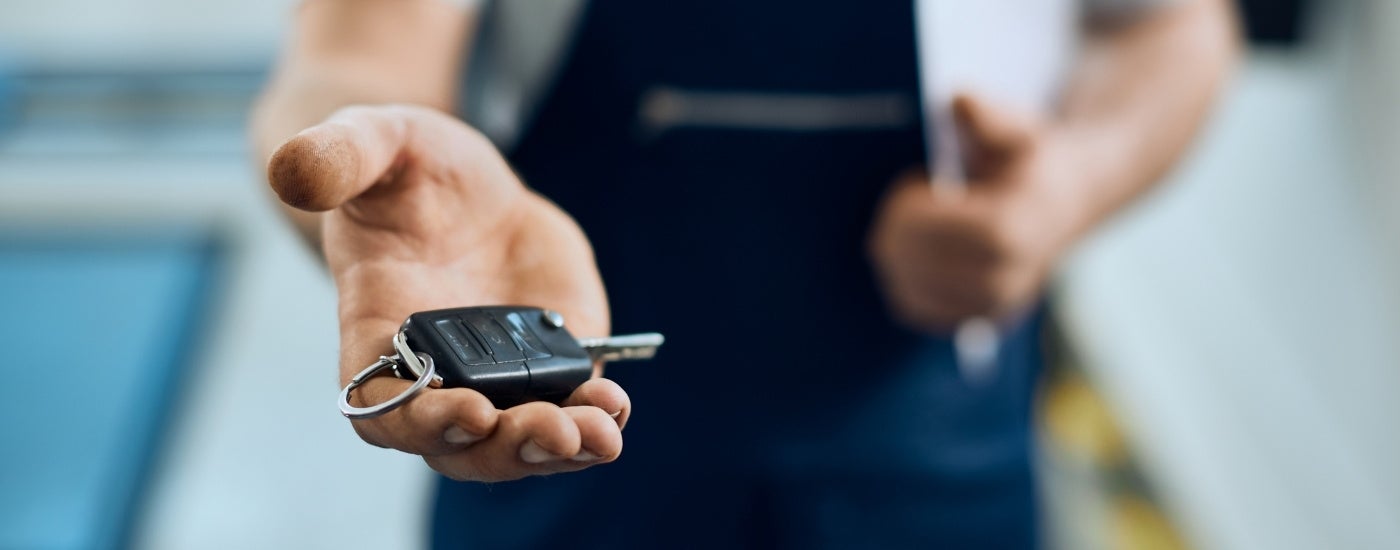 Mechanic holdings a key fob