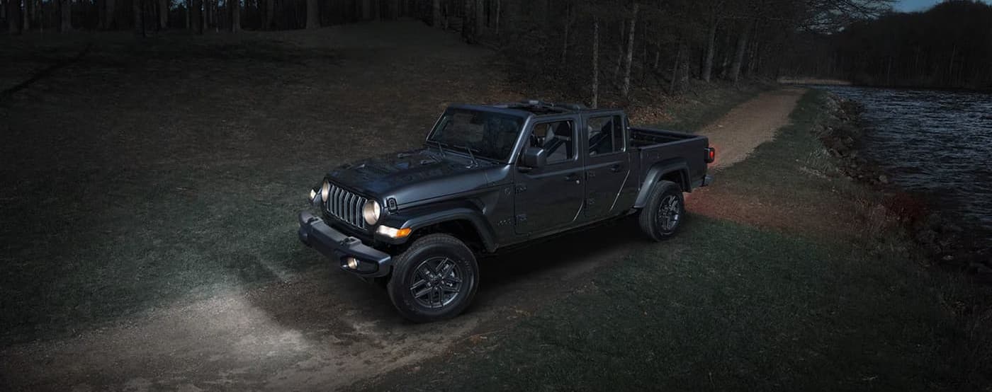 A gray 2026 Jeep Gladiator parked offroad.