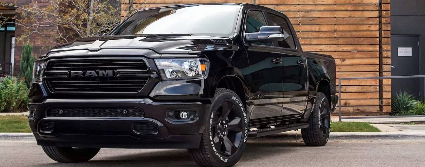Black 2024 Ram 1500 parked on a driveway.