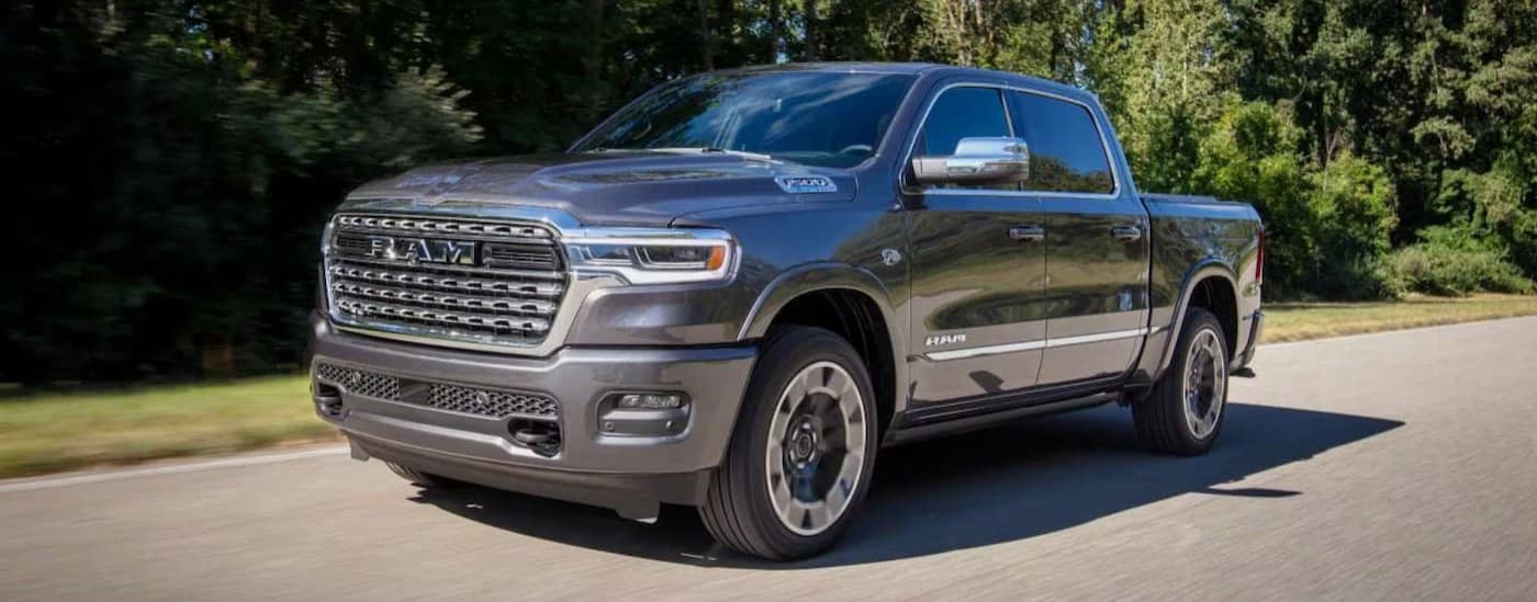 A gray 2027 Ram 1500 driving on a highway.