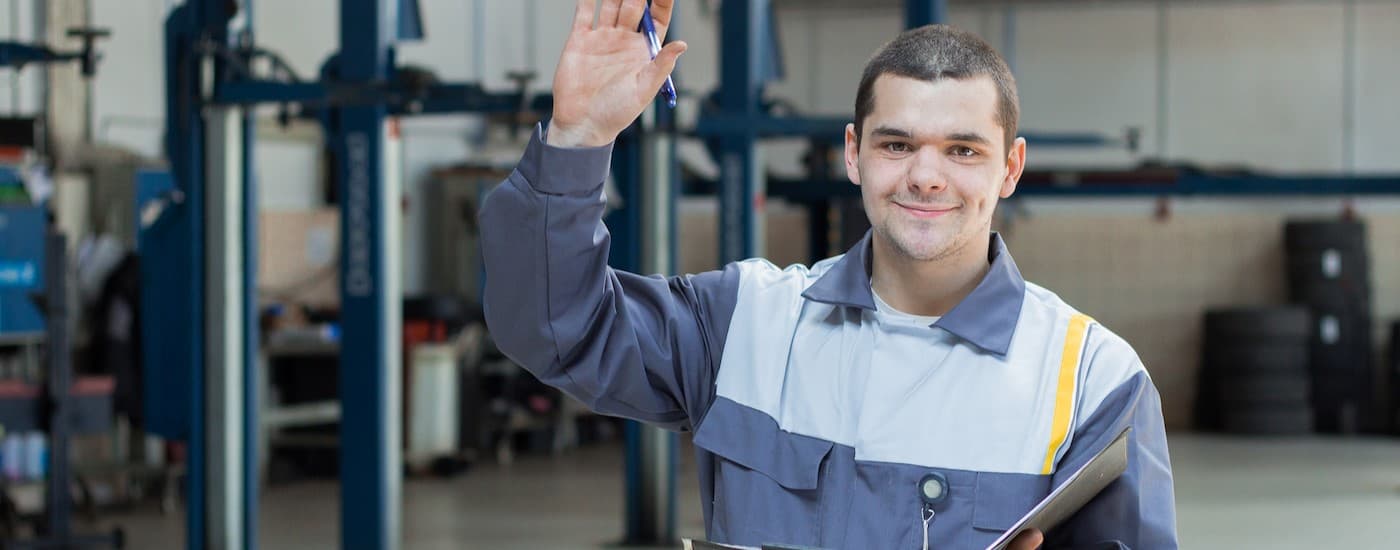 A technician waving.