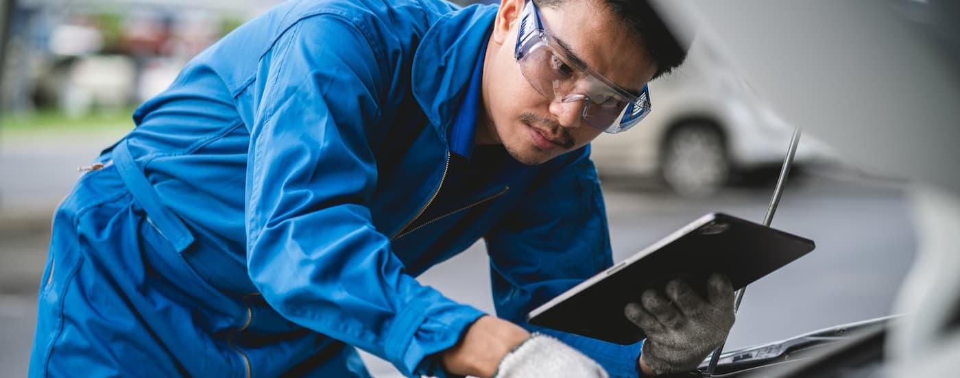 A technician working on a vehicle.